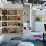 White wooden shelf with books and red ball